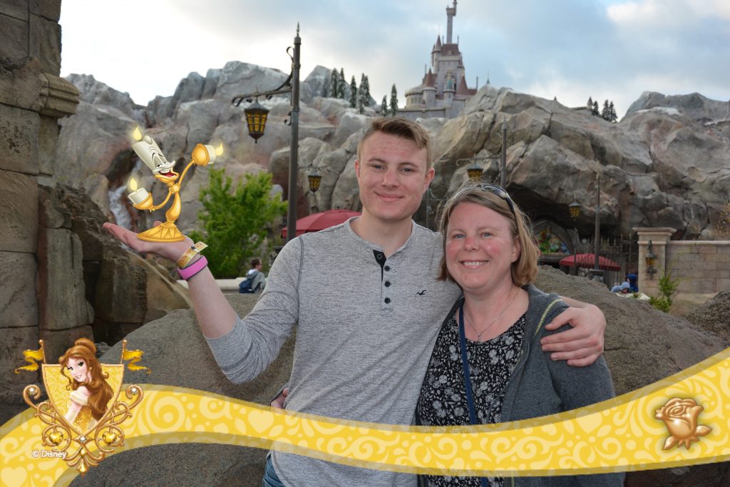 Mom and son at Disney World outside of the Beast's Castle