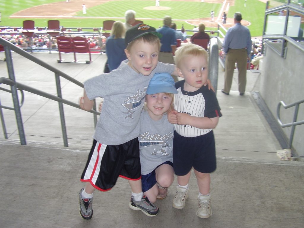 Three young children at Astros Baseball Game