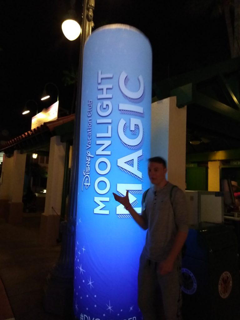 Teen boy with Moonlight Magic sign at Disney's Hollywood Studions
