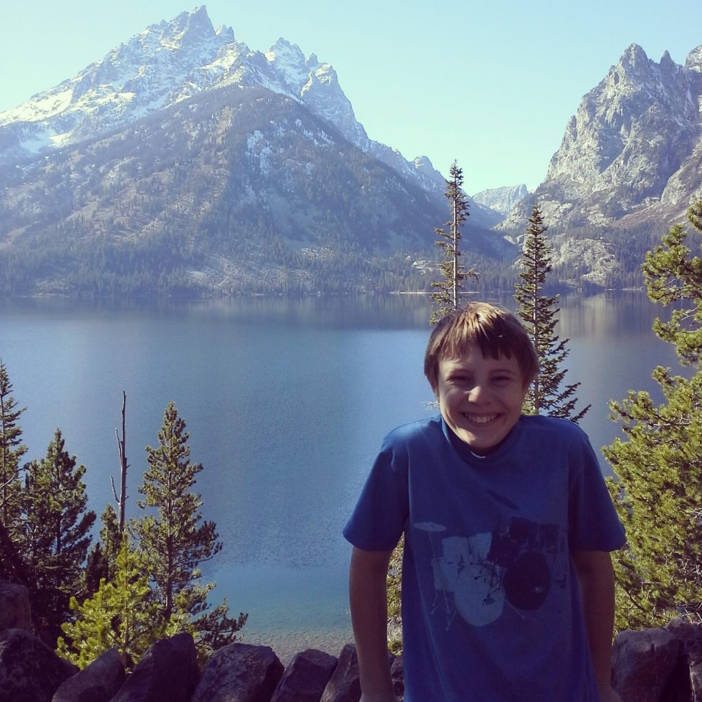 Boy with moutain range behind him