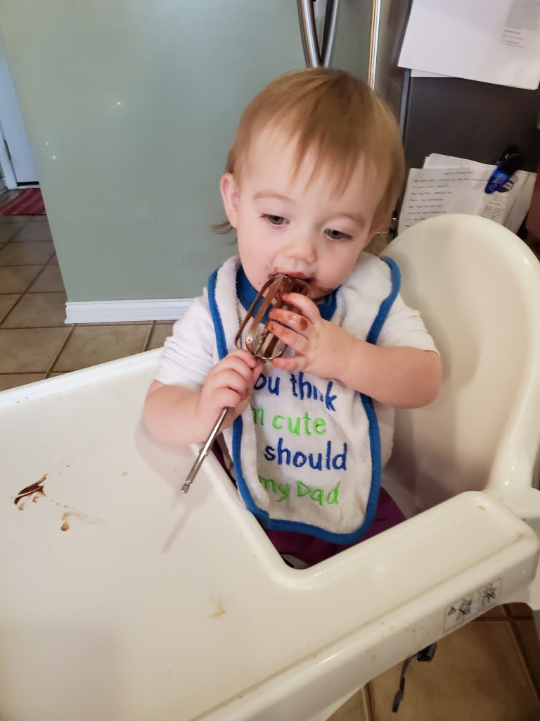 toddler with cake batter